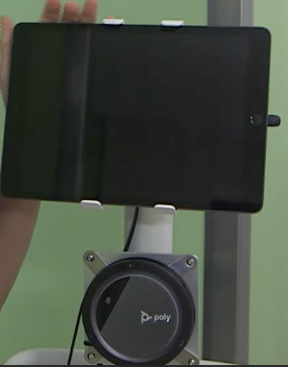 iPad cart with a black speaker below the iPad
